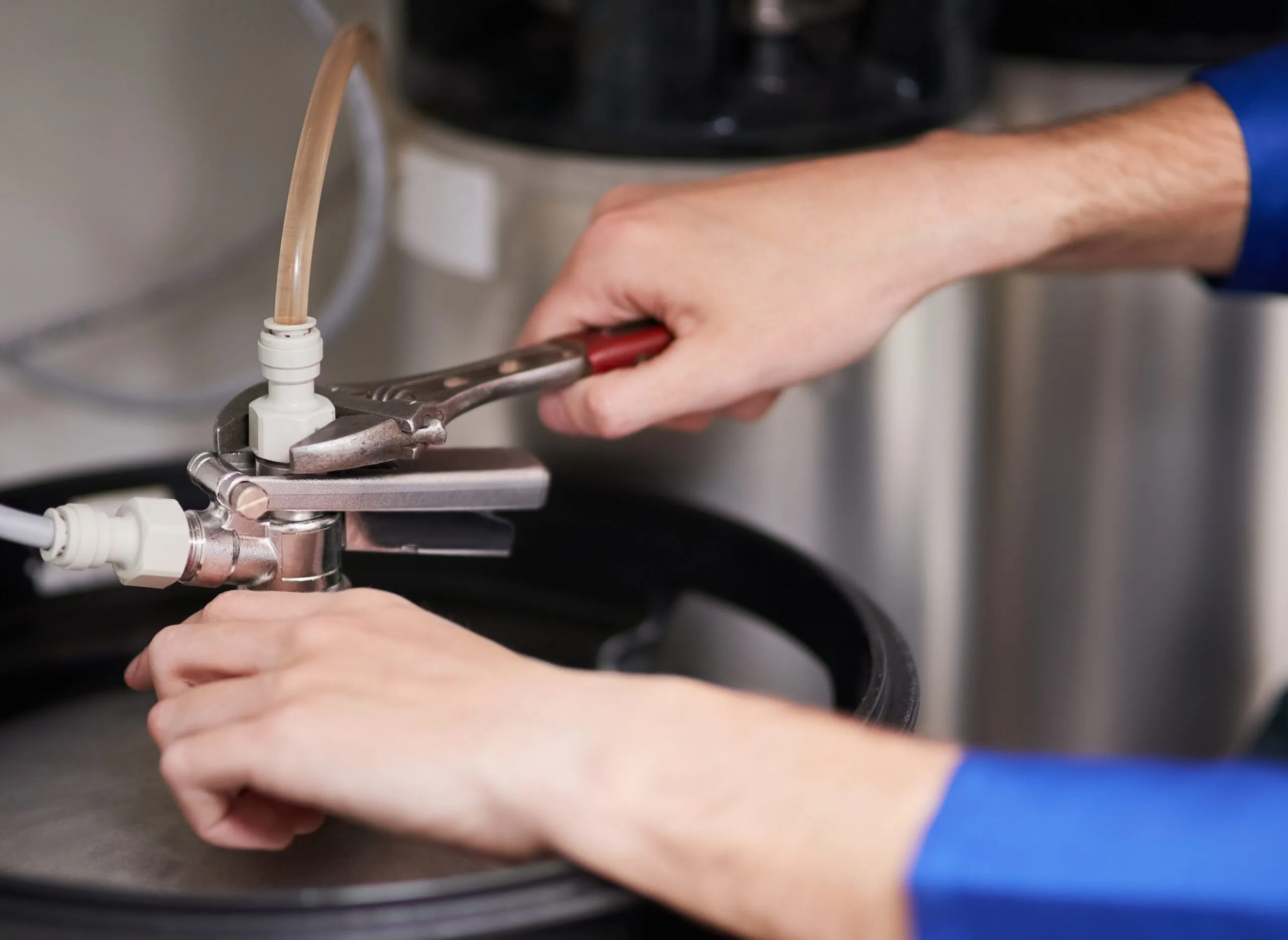 Cropped-shot-of-a-handymanrepairing-a-pipe-on-a-water-heater-awdm,sa