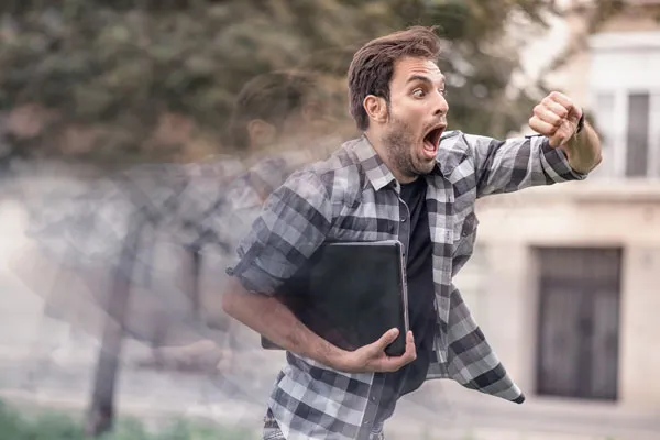 A potrait of a man who is shocked when check time